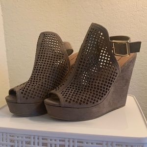 Taupe colored wedges with cutouts